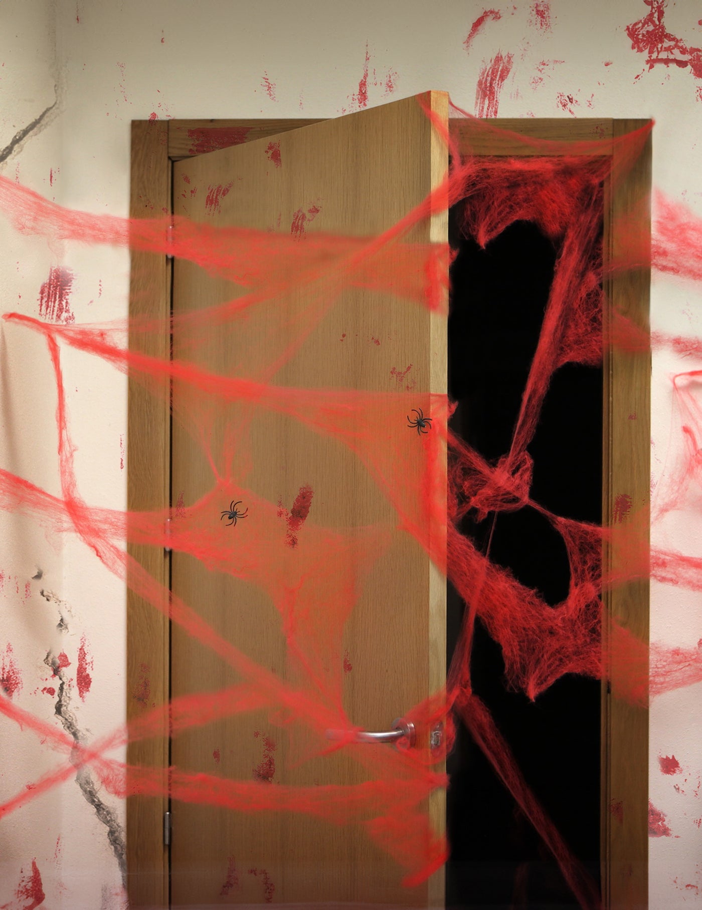 Décoration toile d'araigné rouge avec araignées 20 g Halloween