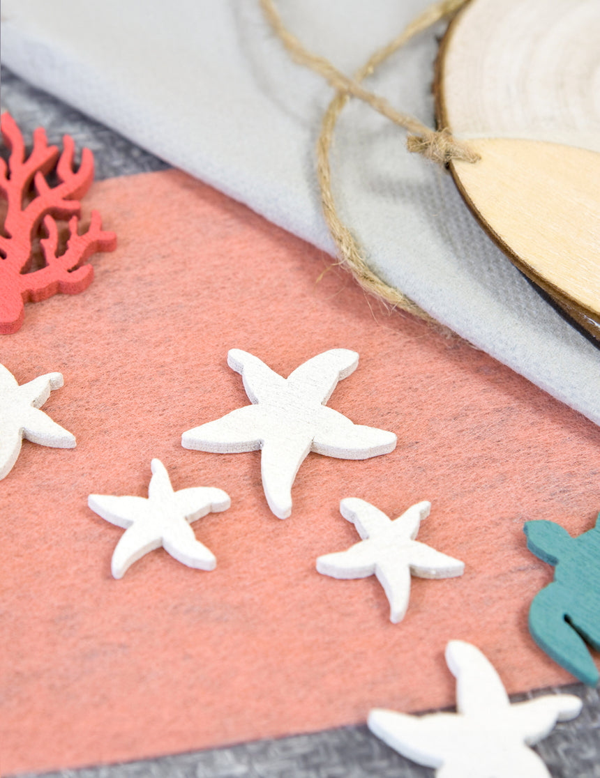12 confettis en bois étoiles de mer blanches 3 et 2 cm thème marin