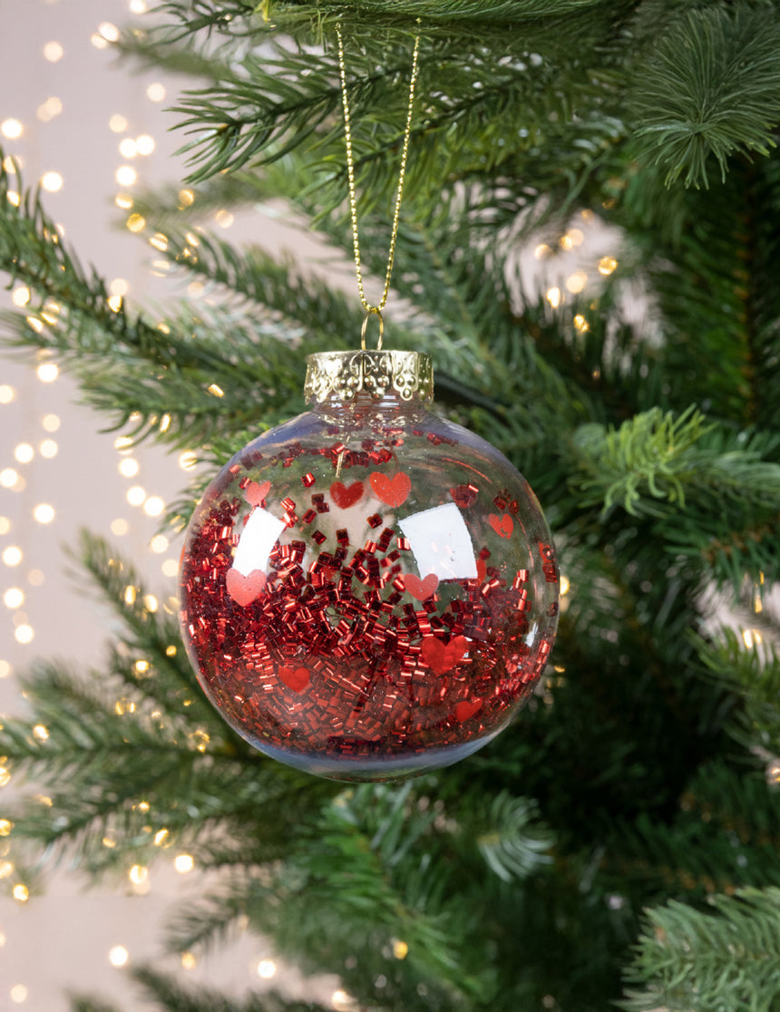Boule de noël transparente avec c?urs rouges et confettis brillants 8 cm