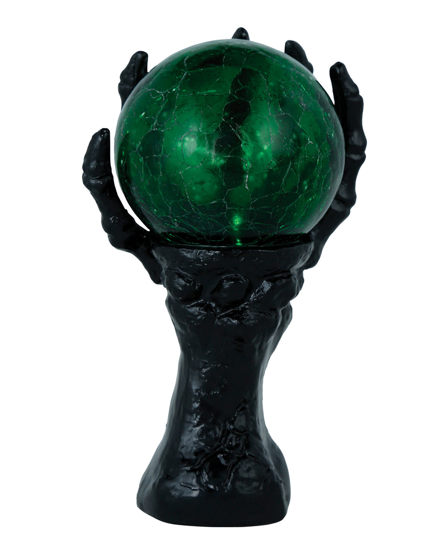 Main squelette noire avec boule de cristal lumineuse